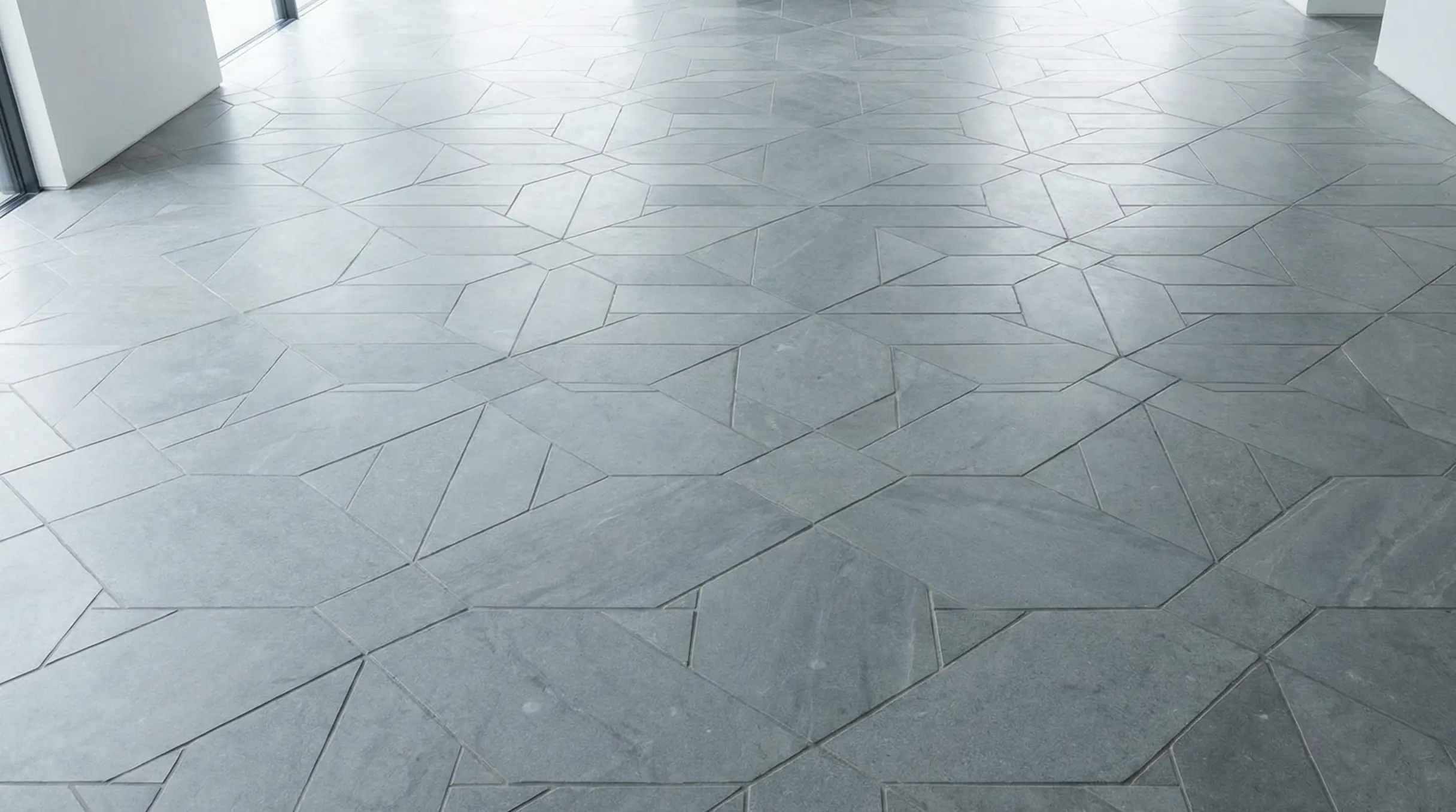 Architectural floor with geometric stone tile layout - Schugar Natursteinfliesen project